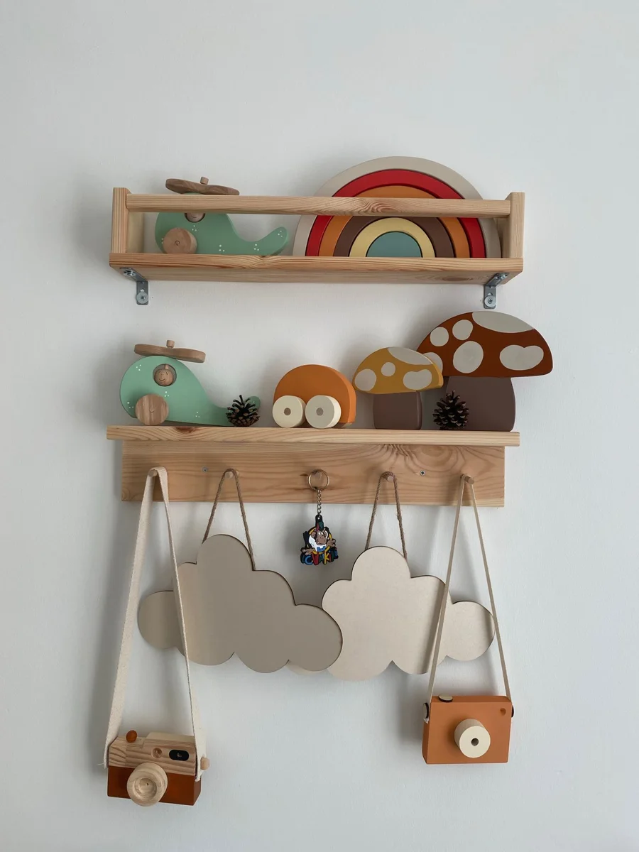Wooden toys are arranged on shelves in a child's room